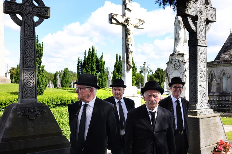 The JoyceStagers Paul Maher, Tim Casey, Ian Blackmore and Peter Prior, before performing The Funeral of Paddy Dignam at Glasnevin Cemetery. Photograph: Dara Mac Dónaill 







