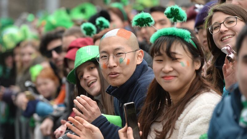 Watching the St Patrick’s Day parade in Dublin. Photograph: Dara Mac Dónaill