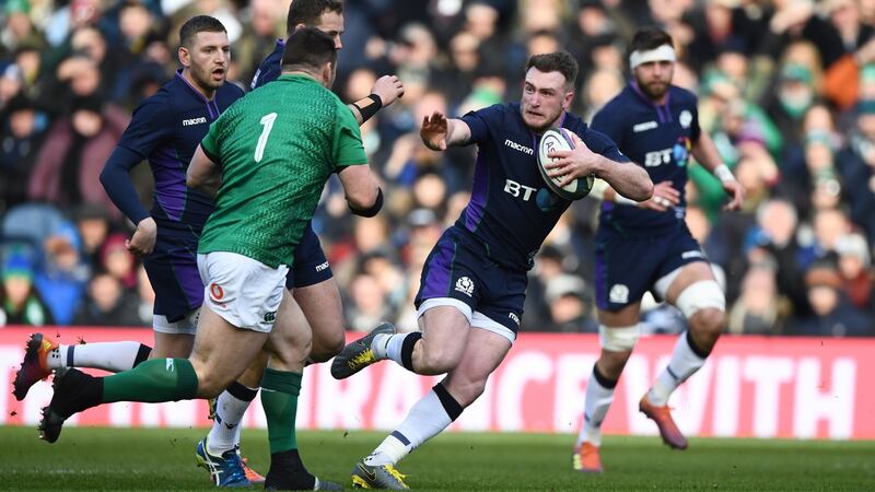 Stuart Hogg prepares to hand off Ireland prop Cian Healy during the  Six Nations match between Scotland and Ireland at Murrayfield last February. Photograph: tu Forster/Getty