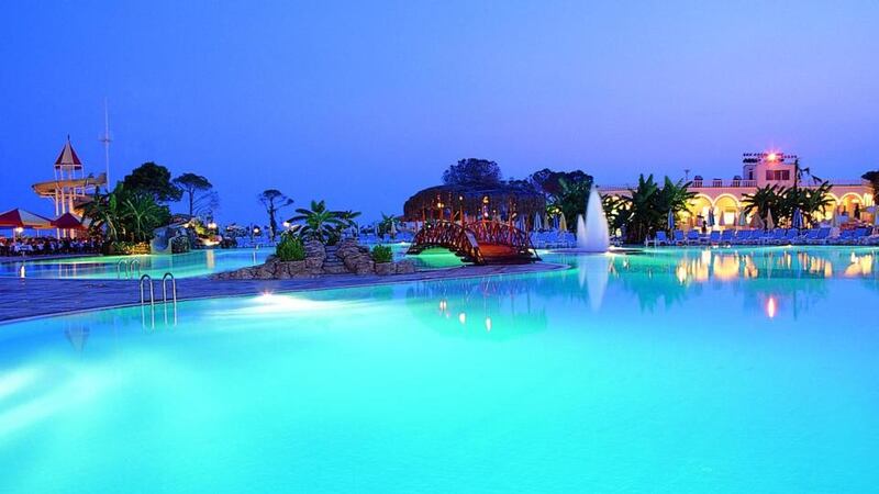 One of the resort’s pools at dusk