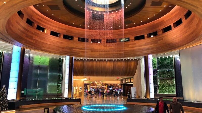 Welcome … the entrance atrium’s timber halo waterfall. Photograph: Oliver Wainwright/The Guardian