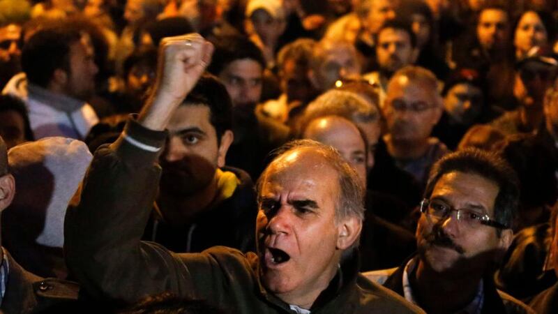 Financial sector workers protest outside the Cypriot parliament in Nicosia. Photograph: Yannis Behrakis/Reuters