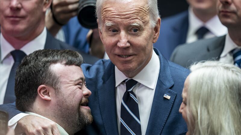 US president Joe Biden embraces James Martin at Ulster University in Belfast in April. Photograph: Aaron Chown/PA