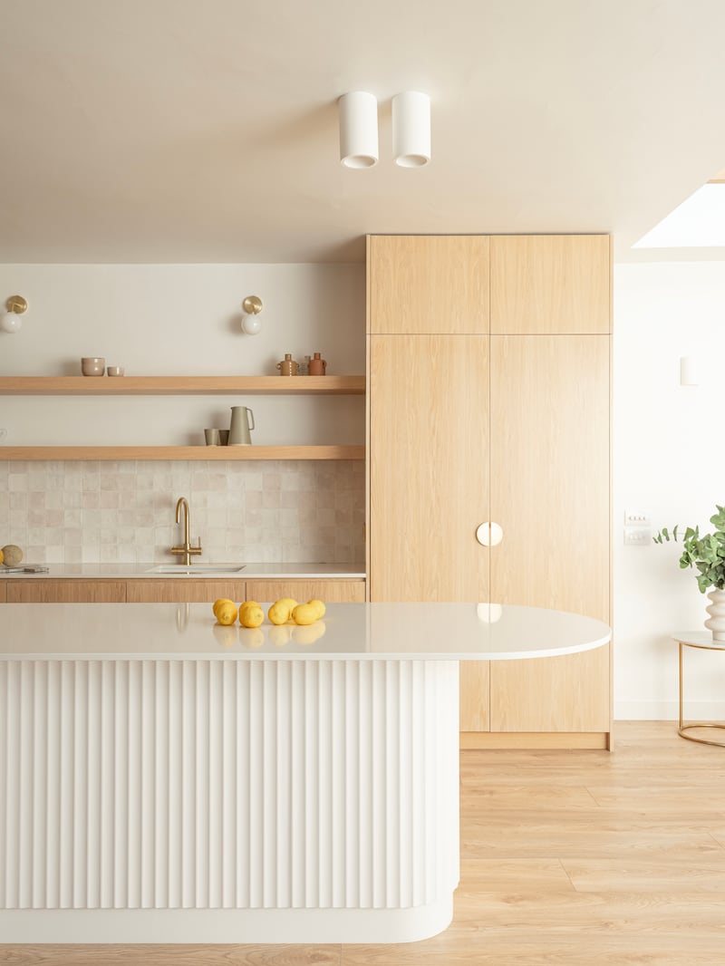 Natural wood kitchen with open shelving and textured island, by architectural designer Courtney McDonnell at Courtney McDonnell Studio. Photograph: Peter Molloy