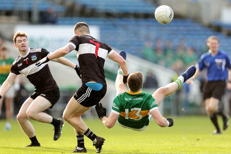 Clonmel Commercials' Colman Kennedy is blocked by Iain Corbett of Newcastle West. Photograph: Laszlo Geczo/Inpho