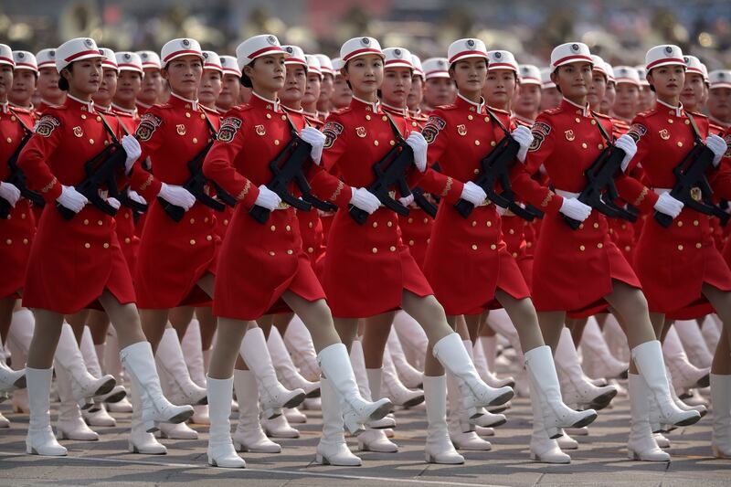 Chinese female militia members march in formation during the parade.  Photo: Mark Schiefelbein