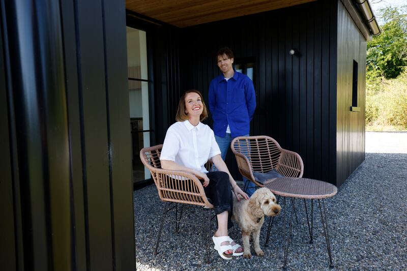 The couple at one of several sheltered outside spaces where they can enjoy the fresh air, rain or shine.