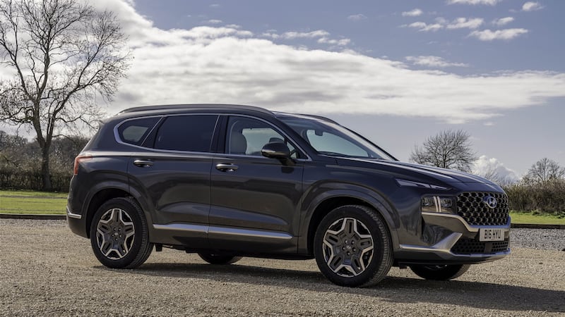The Santa Fe   is an imposing SUV with luxury trim and a plug