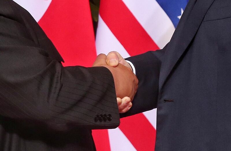 A close up shot of the handshake between US president Donald Trump (R) and North Korean leader Kim Jong-un. Photograph: Kevin Lim/ EPA/The Strait Times