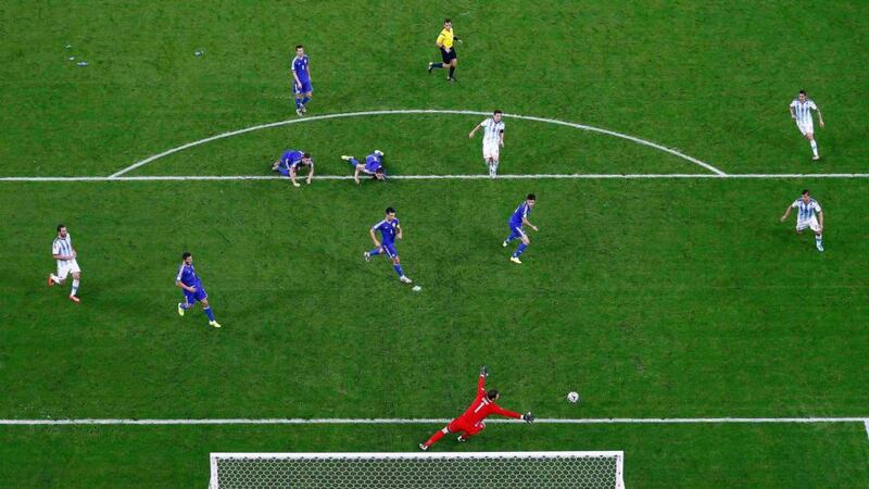 Argentina’s Lionel Messi (centre) scores a goal past Bosnia’s goalkeeper Asmir Begovic (bottom)   at the Maracana stadium in Rio de Janeiro. Photograph: Pawel Kopczynski / Reuters