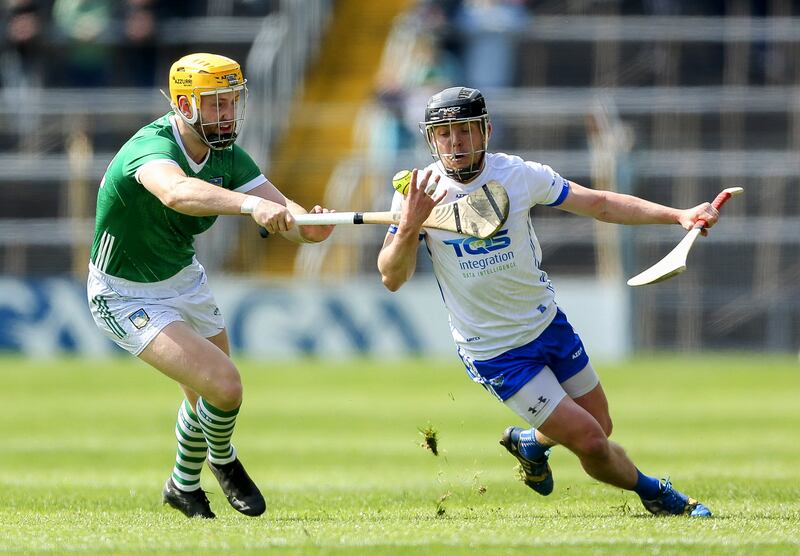 Limerick’s Seamus Flanagan tackles Waterford’s Jamie Barron in last year's Munster championship clash at Thurles. Photograph: Ken Sutton/Inpho 