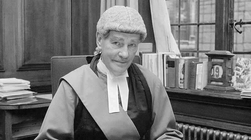 Lord Chief Justice Lord Widgery in his rooms at the Old Bailey in 1972 looking through his report on the Bloody Sunday shootings. He was commissioned to investigate the shootings in their immediate aftermath and quickly produced a report that exonerated the soldiers involved, finding that they had been fired on first by the marchers. The report was long considered a whitewash and an insult to the vicims. Photograph: PA