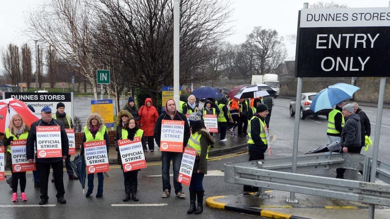 Workers picket the  flagship Dunnes Stores outlet at Cornelscourt in south Dublin. Photograph: Eric Luke / The Irish Times.