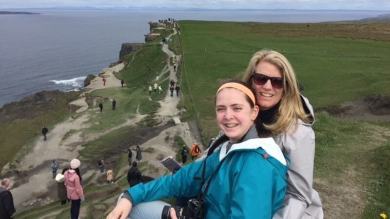 US visitors Emily and Mary Brouder, who were hosted by Owen Mangan, at the Cliffs of Moher.