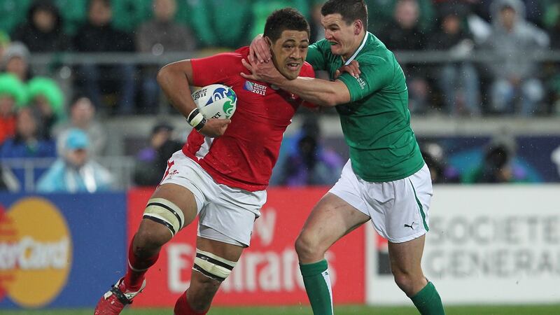 Johnny Sexton tries to tackle Taulupe Faletau during Ireland’s 2011 Rugby World Cup defeat to Wales. Photograph: Billy Stickland/Inpho