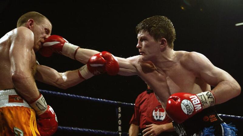 Hatton lands a punch on Magee during their fight in Manchester in 2002. Photo: Mark Thompson/Getty Images
