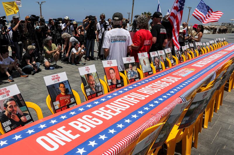 Pictures of the remaining Israeli hostages held in the Gaza Strip since the October 7th, 2023 attacks by Palestinian militants are displayed along a long table by a beach outside the US embassy branch office in Tel Aviv on Friday, calling upon the US to intervene for the hostages' release and for a ceasefire. Photograph: Jack Guez/AFP via Getty Images