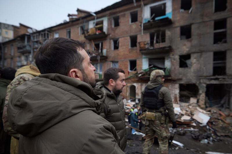 Ukrainian president Volodymyr Zelensky (front) inspects damaged buildings during a visit to the town of Vyshgorod outside Kyiv on December 2nd. Photograph: Ukrainian Presidential Press Office via AP/PA