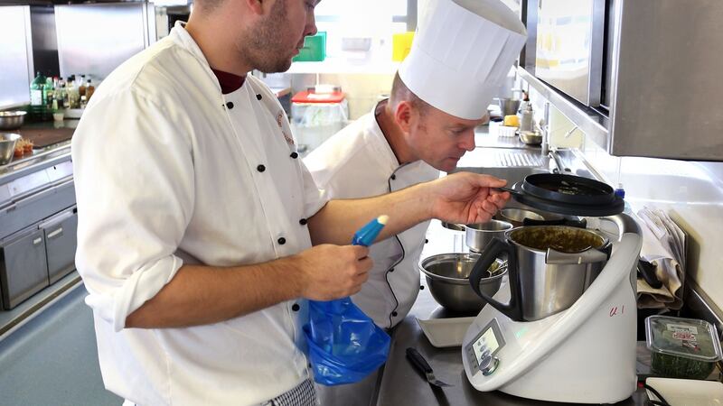 Student James Ruffley (left) prepares Galway Oyster Emulsion Tartlet with Carraghs Micro Leaves at GMIT’s Galway campus. Photograph: Joe O’Shaughnessy
