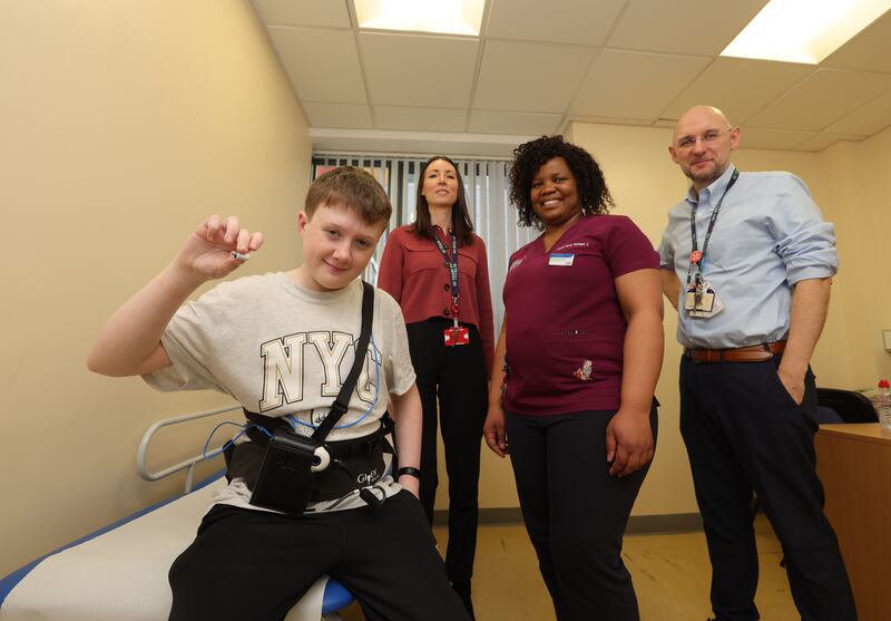 Pioneering paediatric capsule endoscopy patient James with consultant paediatric gastroenterologist Dr Lorraine Stallard, clinical nurse manager Gugulethu Matshazi and Prof Séamus Hussey, CHI at Crumlin's clinical lead for gastroenterology. Photograph: Alan Betson/The Irish Times

