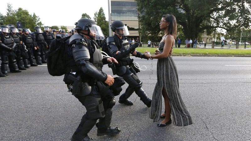 Lone activist Ieshia Evans stands her ground while offering her hands for arrest  during a protest  against police brutality outside   Baton Rouge Police Department in Louisiana, in  July 2016.  Photograph: Jonathan Bachman/Reuters
