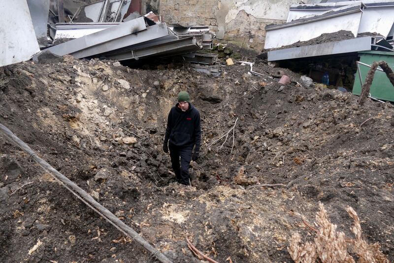 A man stands inside a crater following an overnight drone attack in Odesa, southern Ukraine on Thursday. Photograph: Igor Tkachenko/EPA