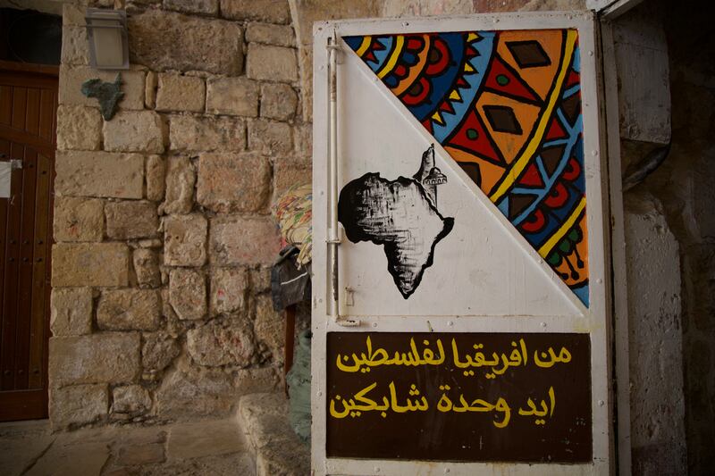 Sign says: from Africa to Palestine, hand in hand. Photograph: Hannah McCarthy