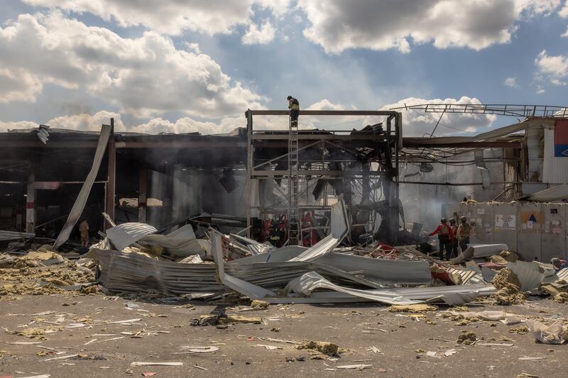 Ukrainian emergency and rescue personnel operate at the site of the destroyed supermarket following a Russian strike, in Kostyantynivka, eastern Donetsk region on Friday. Photograph: Roman Pilipey/AFP via Getty