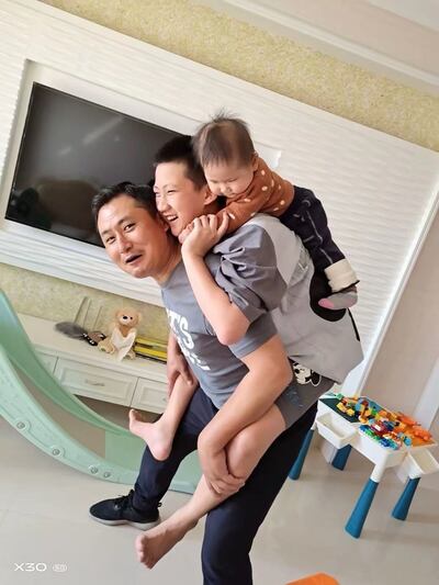 Wu Guo Liang and his family.