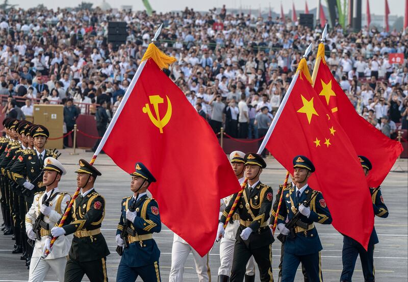 Chinese soldiers march with the national flag during a military parade in Beijing on Wednesday. Photograph: Kevin Frayer/Getty Images
