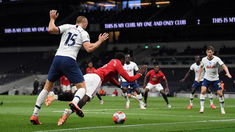 Pogba is brought down by Dier for United’s penalty. Photo: Shaun Botterill/Getty Images
