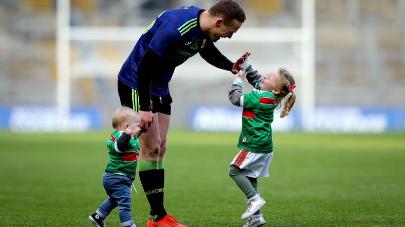 Mayo’s Andy Moran celebrates with his kids Ollie and Charlotte after the victory over Kerry in the  Allianz Football League Division 1 Final at Croke Park. Photograph:  Ryan Byrne/Inpho
