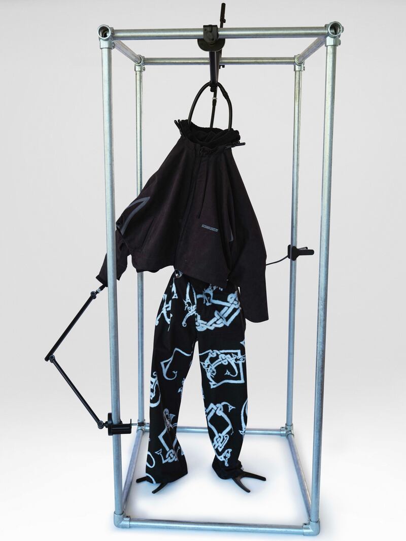 Robyn Lynch black polar fleece hoodie (€115), cropped cotton drill jacket (€225) and screen printed linen trouser (€195)