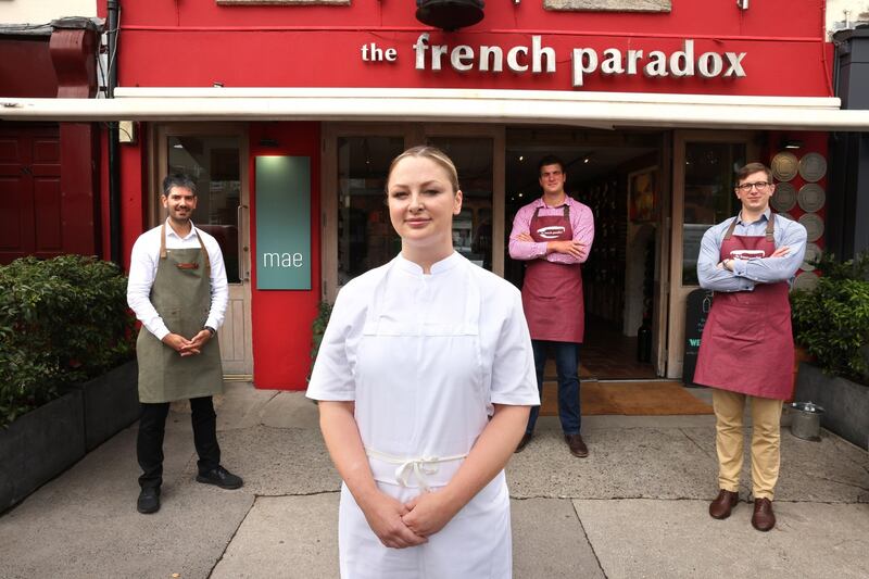 27/07/2021 - MAGAZINE -  Chef Grainne O'Keefe, in her new restaurant Mae, above The French Paradox, at 53 Shelbourne Road, Ballsbridge, Dublin, pictured with Julien Chaigneau, manager and Patrick and Jacques Chapeau, in the wine shop The French Paradox.Photograph: Dara Mac Dónaill / The Irish TimesPhotograph: Dara Mac Donaill / The Irish Times