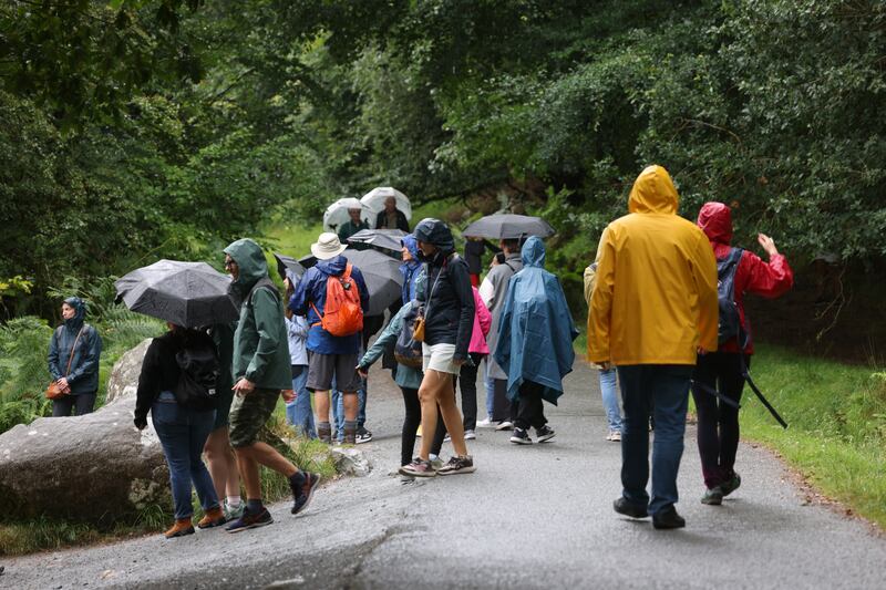 Tourists in Glendalough on the day Stephen Conneely walked there from Hollywood via St Kevin’s Way. Photograph: Bryan O’Brien