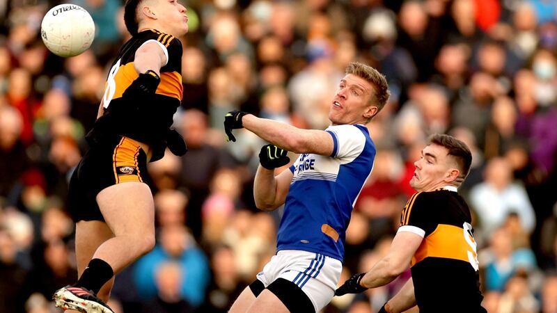 Austin Stack’s Joseph O’Connor and Greg Horan with Tommy Walsh of Kerin O’Rahilly’s. Photograph: James Crombie/Inpho