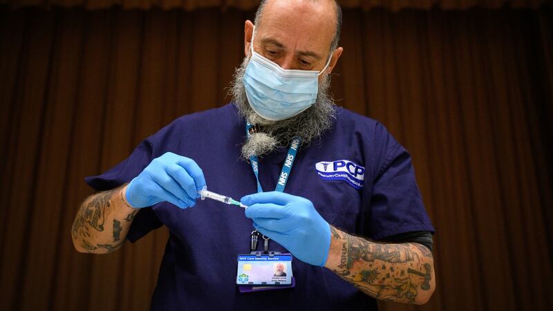 Covid vaccine:  nearly one in five people says they won’t get the vaccine. If one of them is at your Christmas table, things may get heated. Photograph: Leon Neal/Getty Images