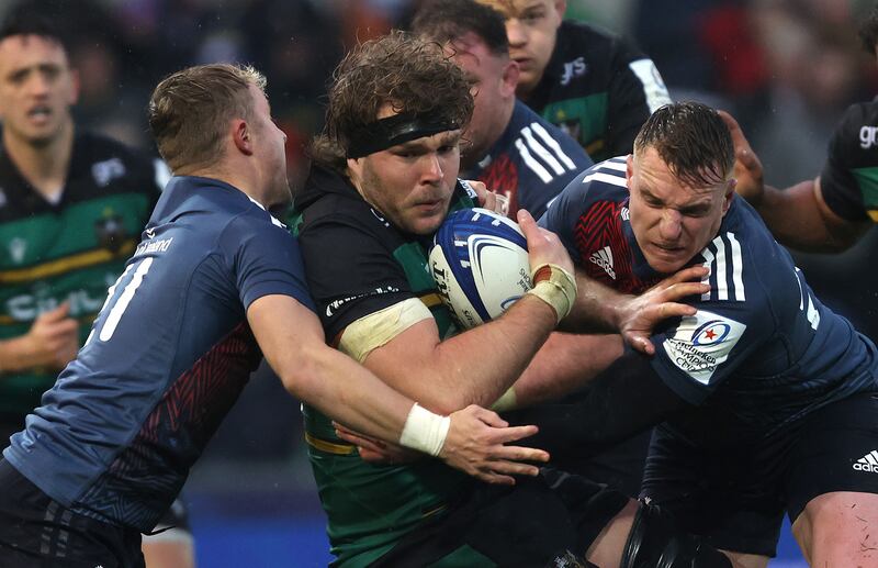 Northampton’s Angus Scott Young finds no way past Munster's Craig Casey and Rory Scannell. Photograph: Bryan Keane/Bryan Keane