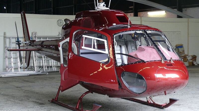 A stock picture of the privately-owned twin squirrel red helicopter that crashed in north Wales with five people on board. Photograph: High Level/Rex/Shutterstock/Guardian Service