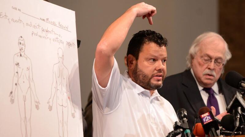 Shawn Parcells, forensic pathologist assistant and medical investigator, explains the trajectory of one of the bullets which struck Michael Brown according to an independent autopsy during a press conference at the Greater St. Marks Family Church in Ferguson, Missouri, USA. Photograph: Roberto Rodriguez/EPA
