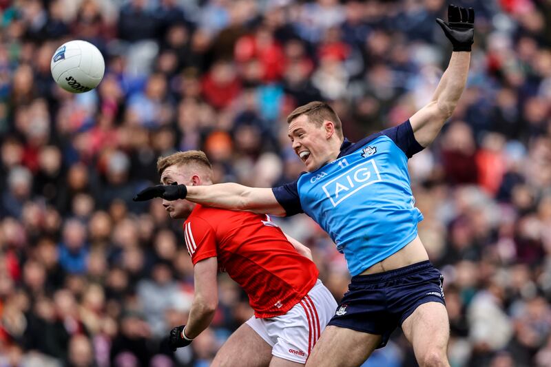 Louth's Peter Lynch competes in the air with Con O’Callaghan of Dublin. Photograph: Ben Brady/Inpho
