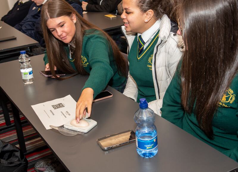 A student feels the contraceptive implant in a 'dummy arm' during the workshop. Photograph: Kevin McFeely/Fly Media