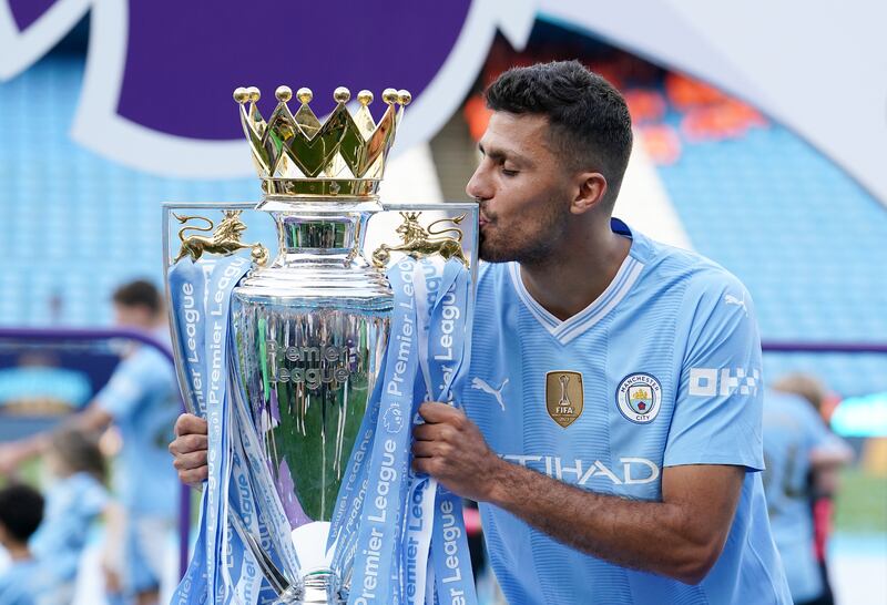 Manchester City's Rodri kissing the Premier League trophy. Photograph: Martin Rickett/PA