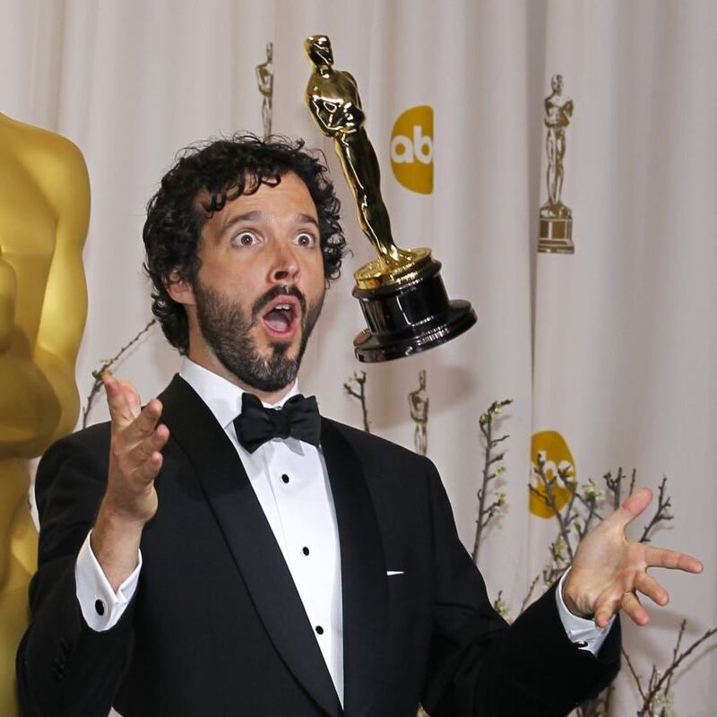 Oscar winner: Bret McKenzie with his best-song award, ‘Man or Muppet’, from ‘The Muppets’. Photograph: Mike Blake/Reuters