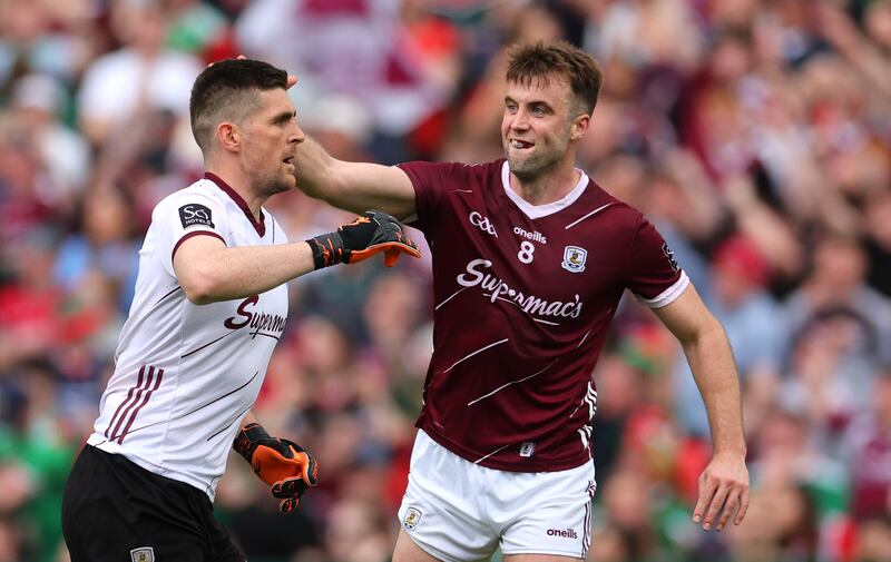 Galway’s goalkeeper Connor Gleeson celebrates kicking the winning point with Paul Conroy Photograph: James Crombie/Inpho