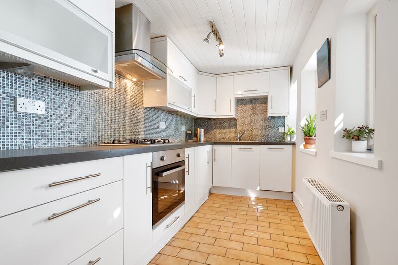 There is a galley kitchen to the rear of the property.