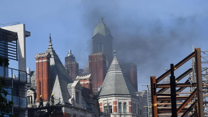 Firefighters tackle a blaze at the Mandarin Oriental hotel in central London on Wednesday. Photograph: Ben Stansall/AFP/Getty Images