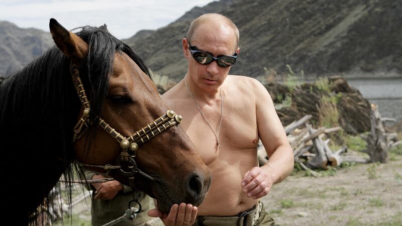Putin with a horse on vacation. Photograph: Alexey Druzhinin/AFP/Getty Images