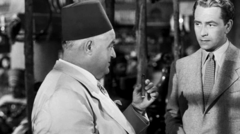 Exit at minute 59, just after Ilsa and Laszlo have failed to get visas from  Ferrari