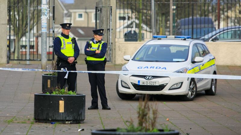 Gardaí at the scene of the shooting at Mizzoni’s Pizza in Edenmore, Dublin. Photograph: Collins